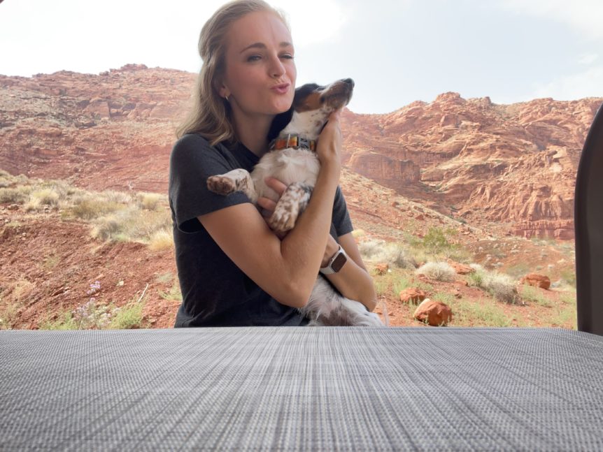 Mallory King holding her pup at Tucacahn,